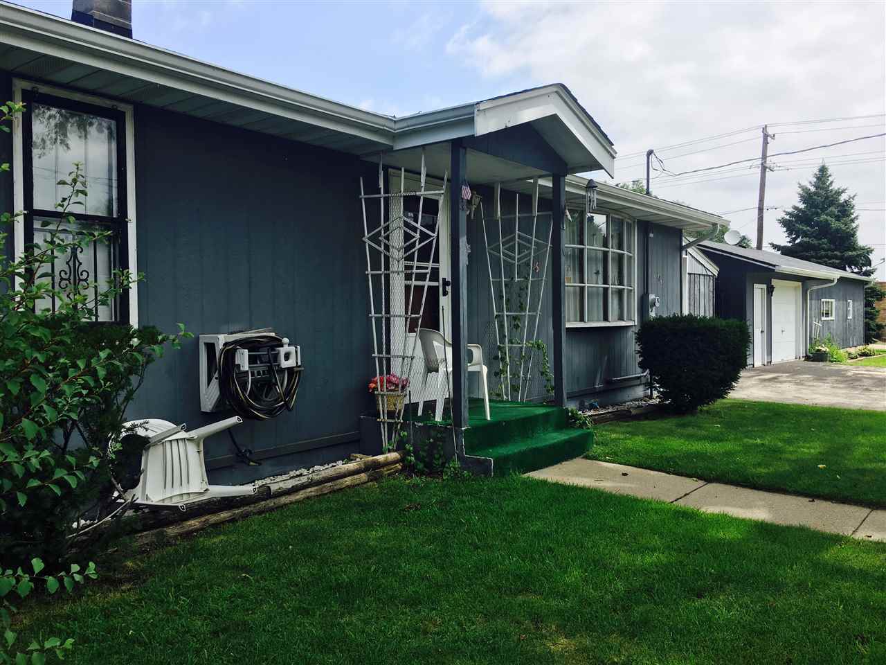 616 Barry Road Rockford, IL 61109 - Photo 2 of 15 a front view of a house with garden