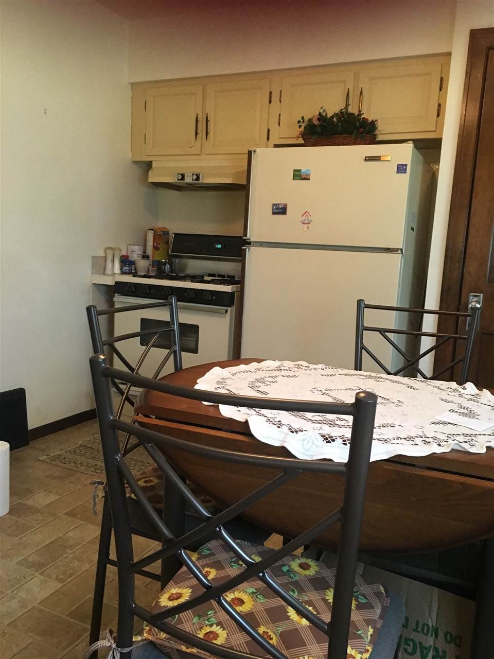 616 Barry Road Rockford, IL 61109 - Photo 6 of 15 a kitchen with a table and chairs