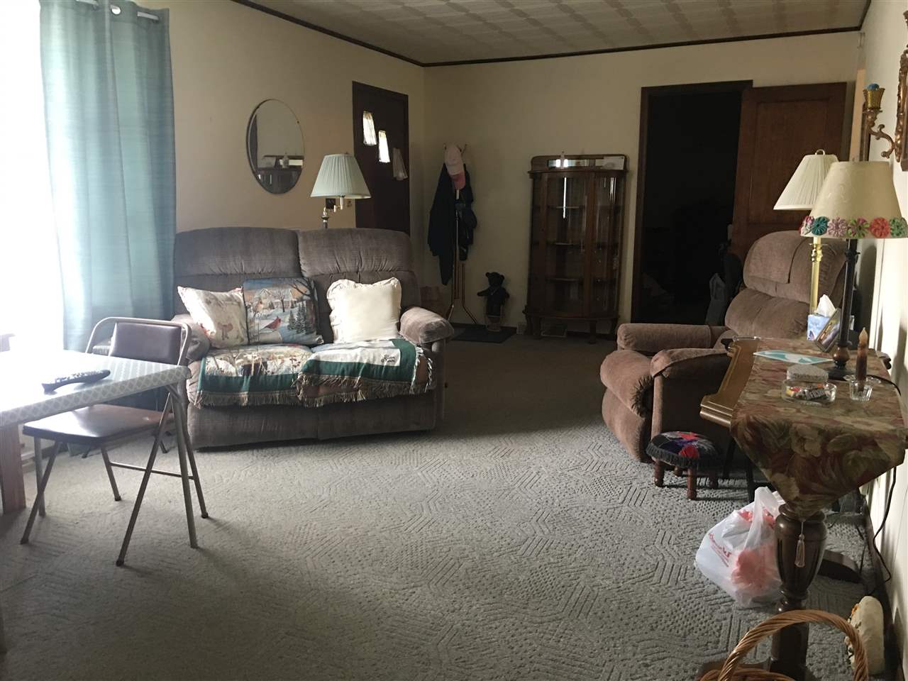 616 Barry Road Rockford, IL 61109 - Photo 7 of 15 a living room with furniture and a lamp