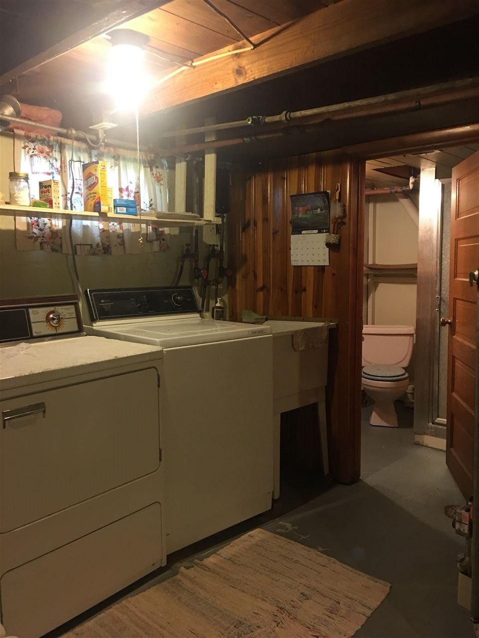 616 Barry Road Rockford, IL 61109 - Photo 9 of 15 a room with water heater and wooden cabinets