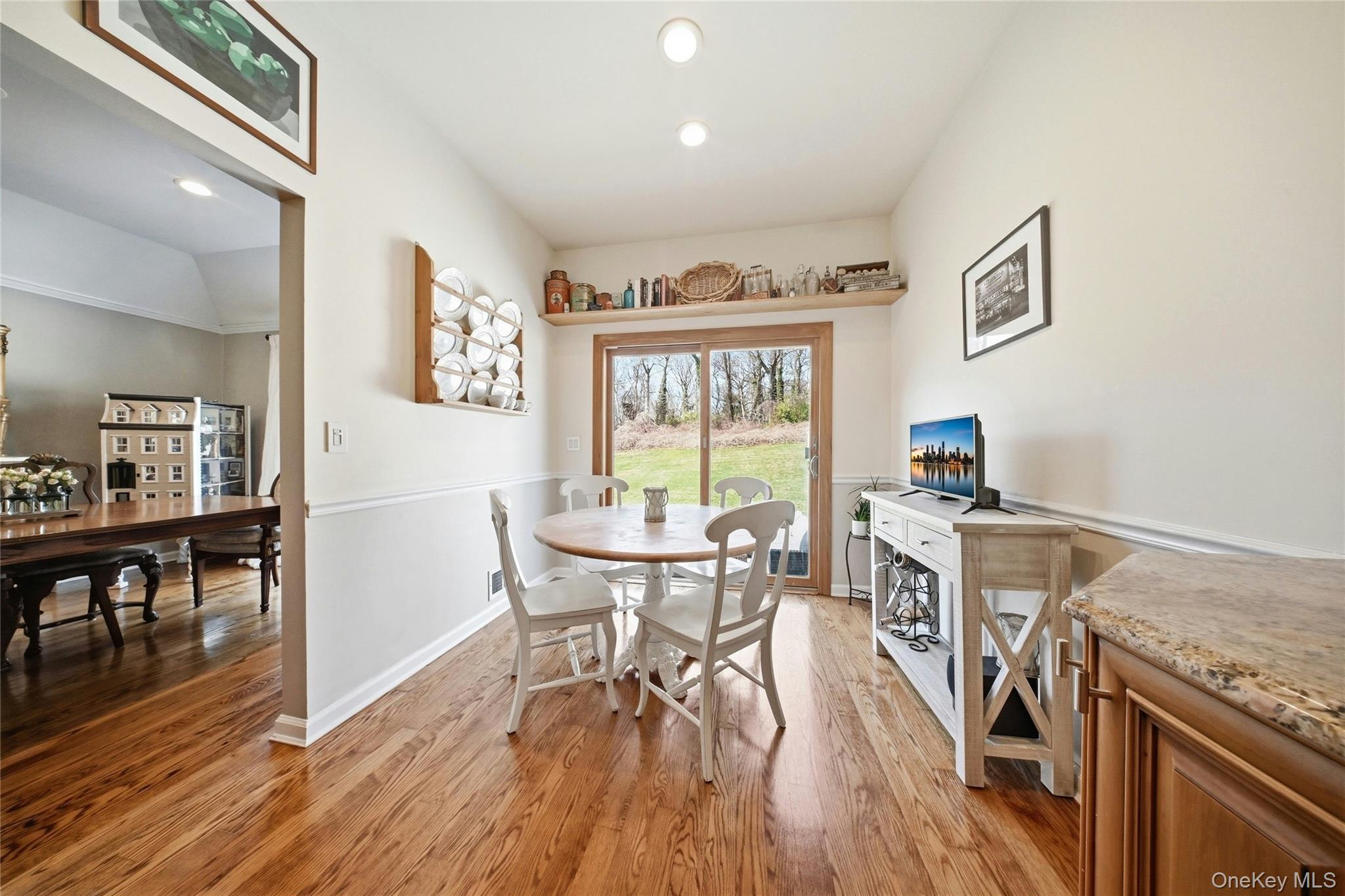 78 Hidden Ridge Drive Syosset, NY 11791 - Photo 7 of 21 a view of a dining room with furniture and wooden floor