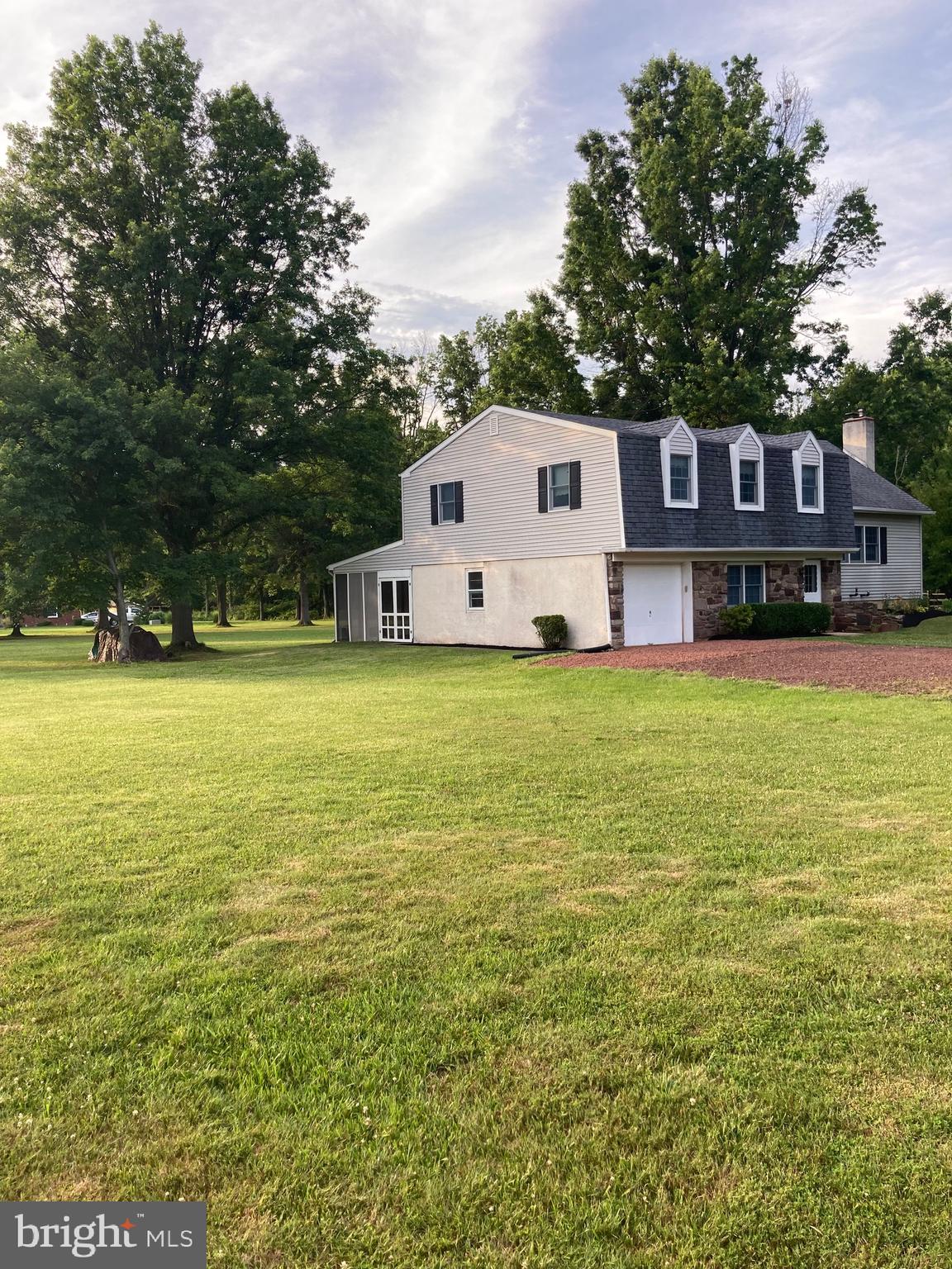 5791 Stump Road Pipersville, PA 18947 - Photo 3 of 4 a house view with a sitting space and garden