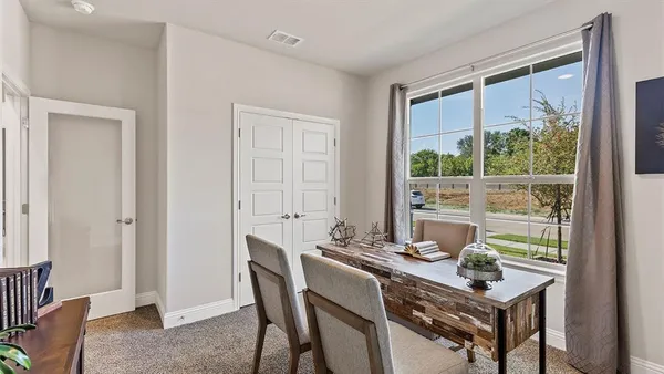 a view of a dining room with furniture window and outside view