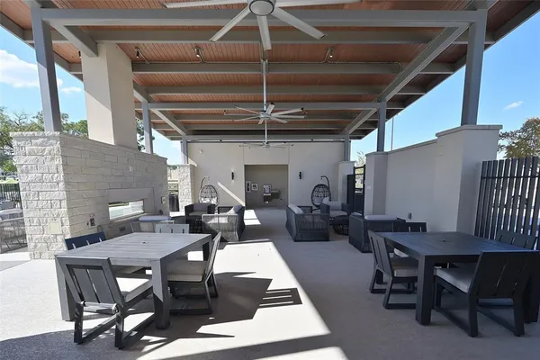 a outdoor space with lots of furniture and white walls