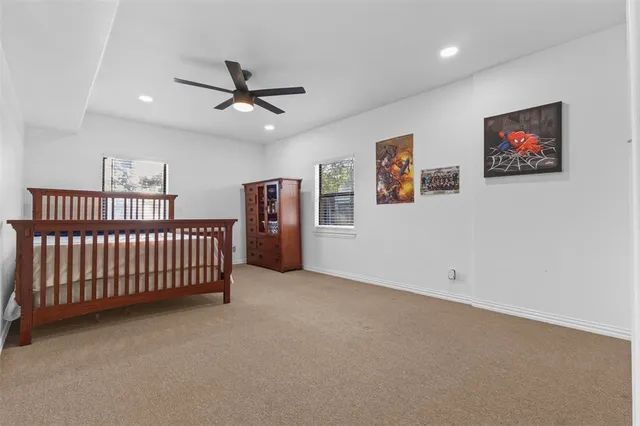 a view of a livingroom with a staircase and a chandelier
