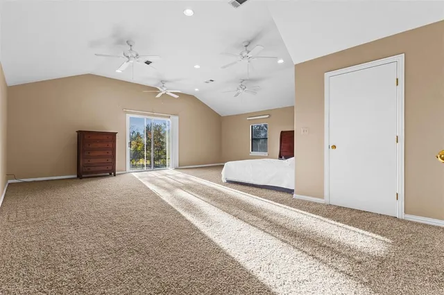 a living room with furniture and a ceiling fan