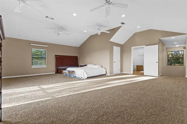 a view of a bedroom with closet and natural light