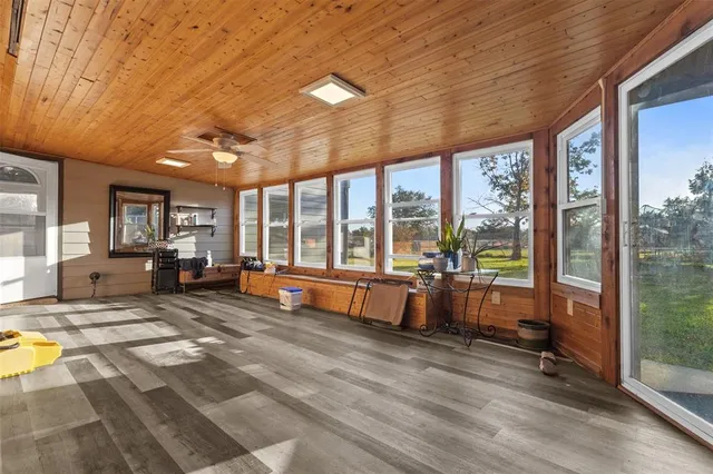 a bathroom with a shower sink and a mirror