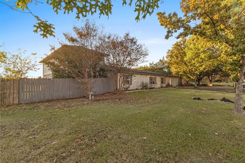 1108 Blackland Road Fate, TX 75189 - Photo 23 of 28 a backyard of a house with lots of green space