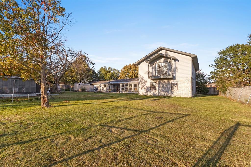 1108 Blackland Road Fate, TX 75189 - Photo 24 of 28 a front view of a house with a yard