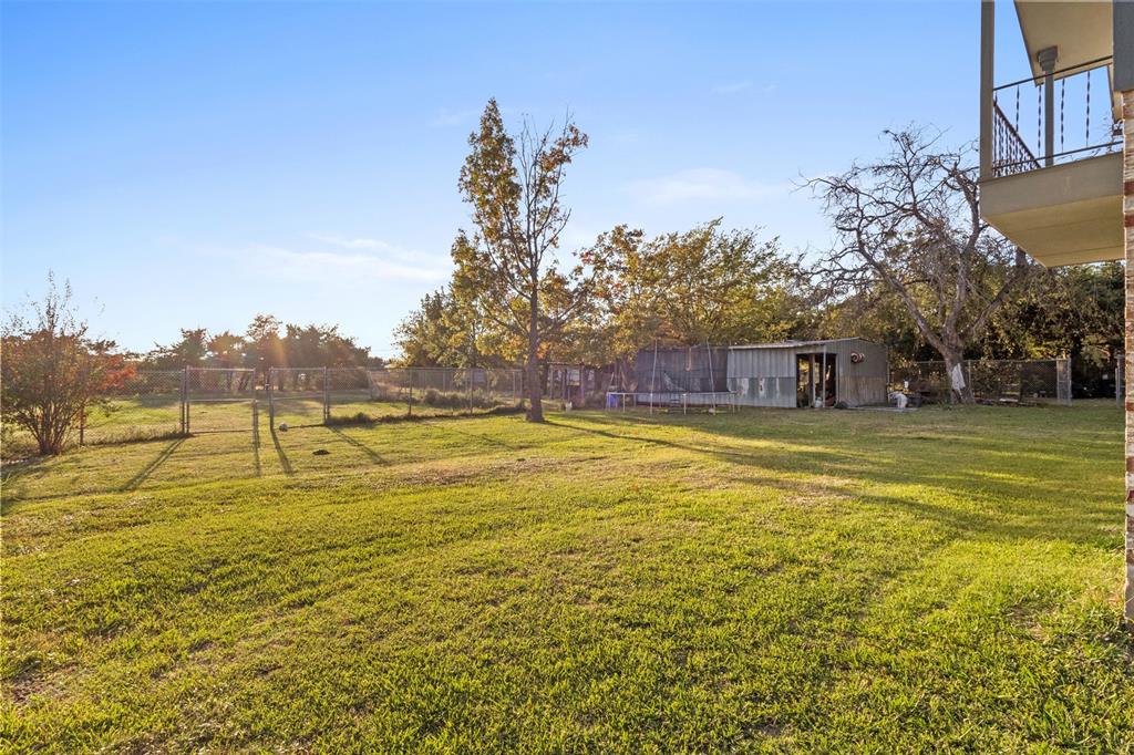 1108 Blackland Road Fate, TX 75189 - Photo 27 of 28 a swimming pool with an outdoor space and seating area