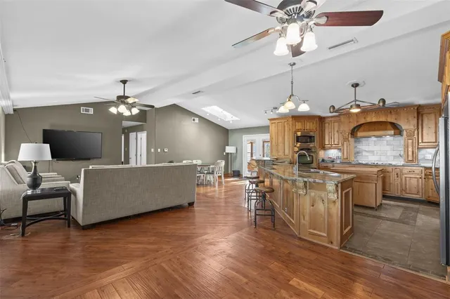 a swimming pool with an outdoor space and seating area