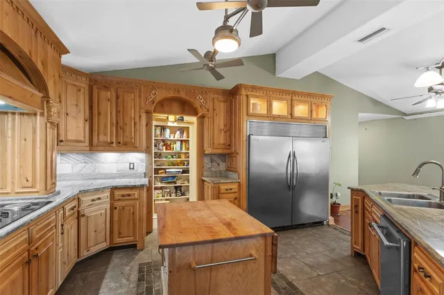 a kitchen with a stove and a microwave