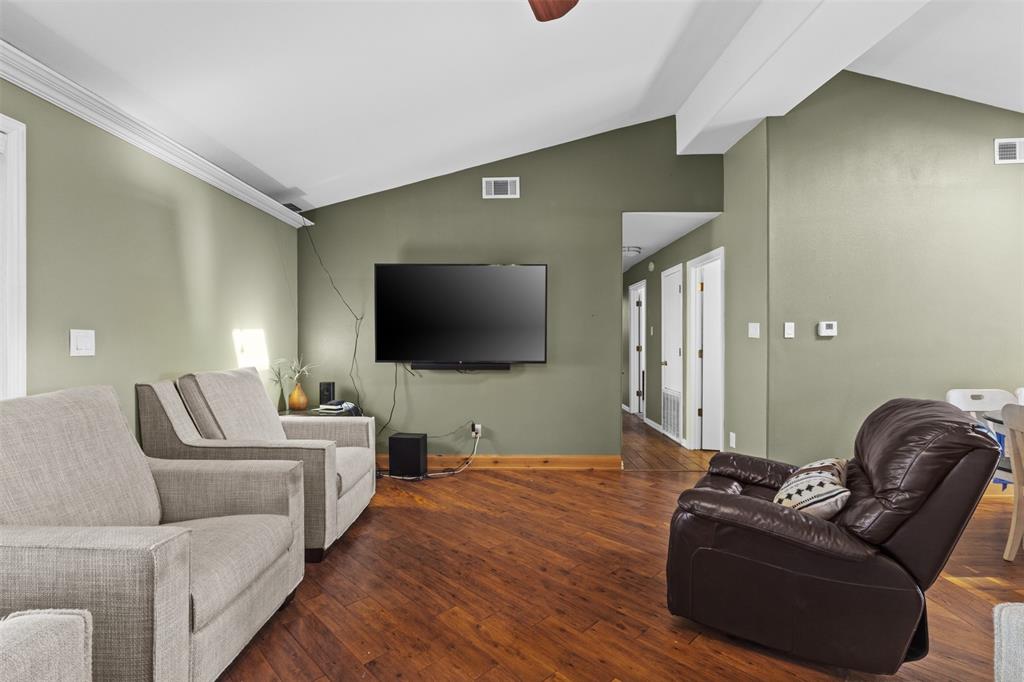 1108 Blackland Road Fate, TX 75189 - Photo 8 of 28 a living room with furniture and a flat screen tv