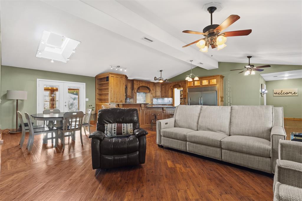 1108 Blackland Road Fate, TX 75189 - Photo 9 of 28 a living room with furniture and wooden floor