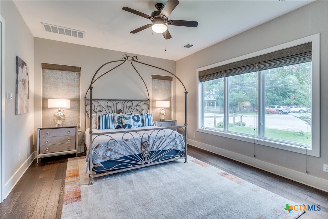 911 Farm Street Bastrop, TX 78602 - Photo 13 of 40 a bedroom with a bed and window