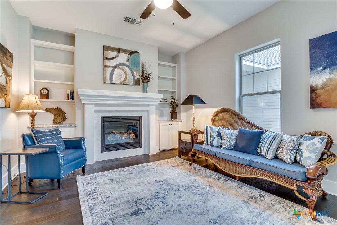 911 Farm Street Bastrop, TX 78602 - Photo 16 of 40 a living room with furniture and a fireplace