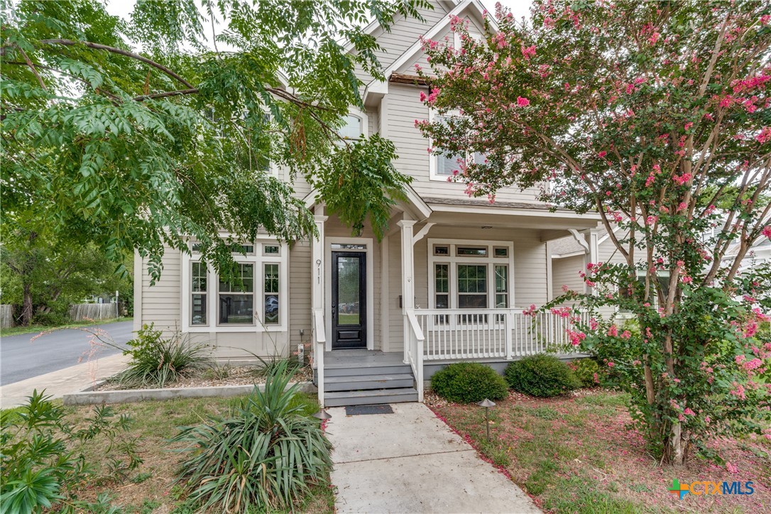 911 Farm Street Bastrop, TX 78602 - Photo 2 of 40 front view of a house with a small yard