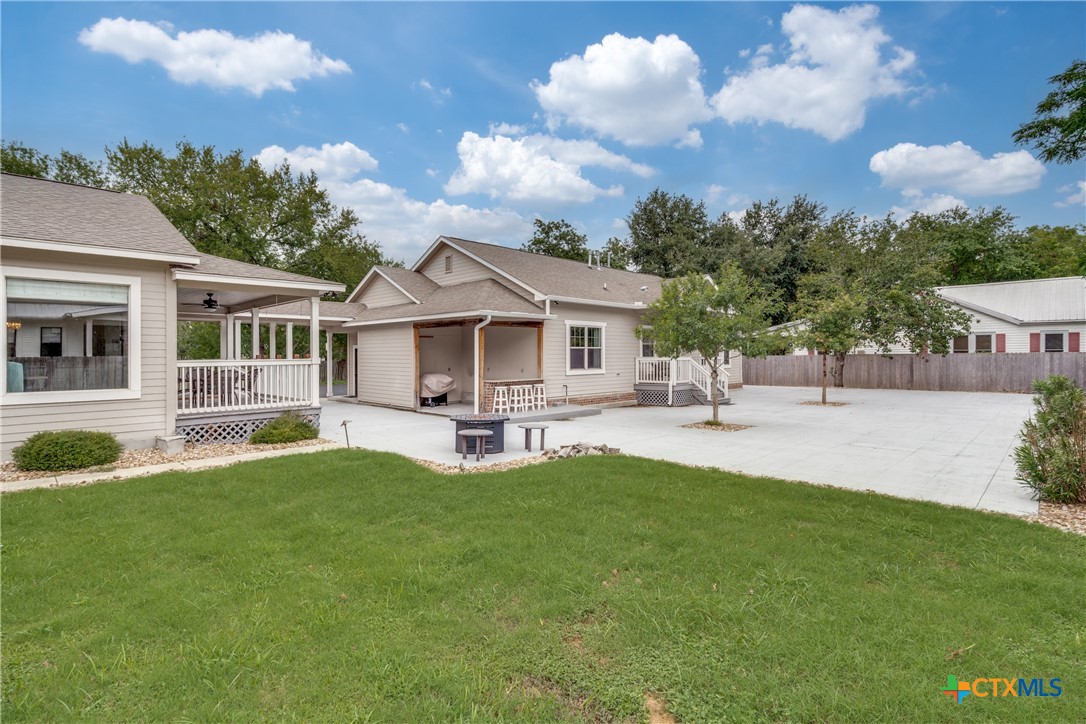 911 Farm Street Bastrop, TX 78602 - Photo 24 of 40 a view of a house with swimming pool and sitting area