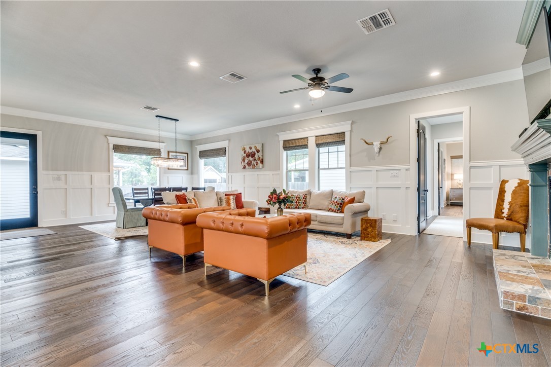 911 Farm Street Bastrop, TX 78602 - Photo 4 of 40 a living room with furniture and a wooden floor