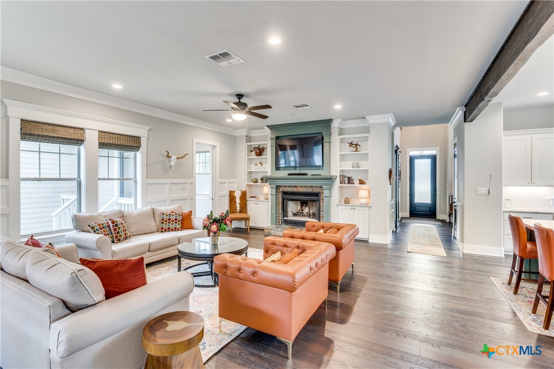 911 Farm Street Bastrop, TX 78602 - Photo 5 of 40 a living room with furniture and a fireplace