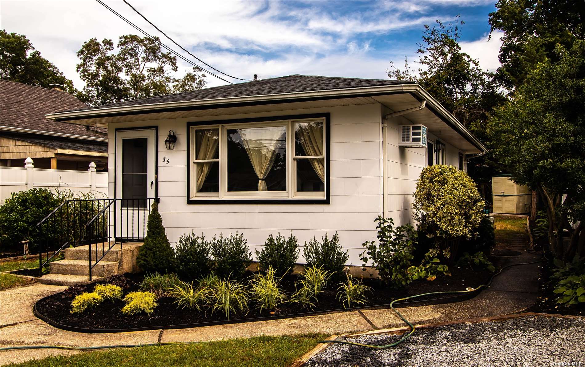 a front view of a house with garden