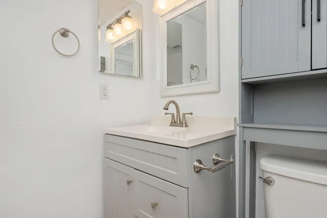 a bathroom with a sink and mirror