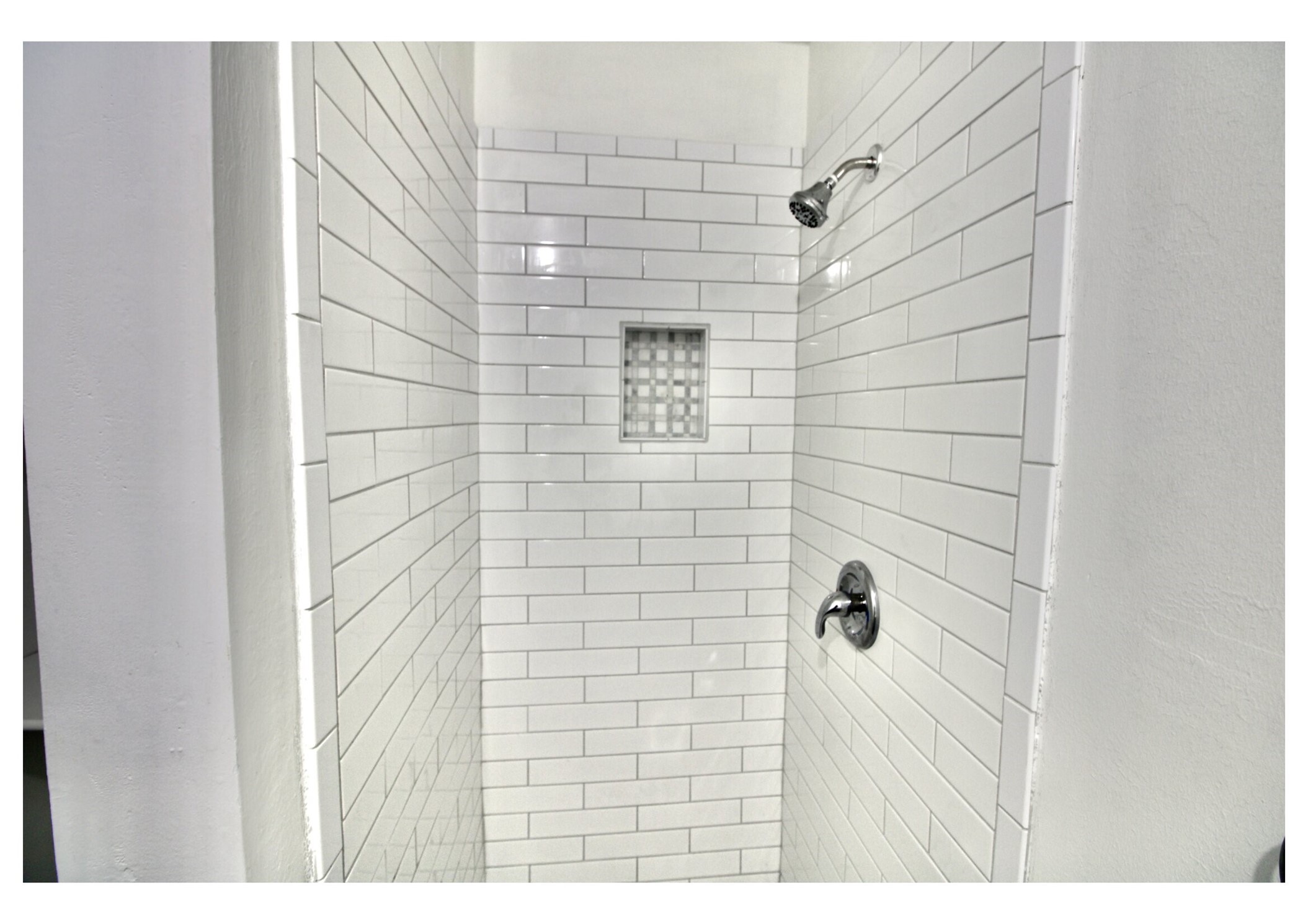 409 Robert Lee Road Houston, TX 77009 - Photo 10 of 32 The bathroom features a crisp, modern-minimalist aesthetic that appeals to both homeowners and professional office users.