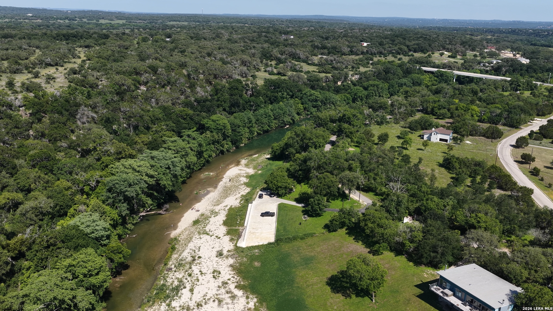 682 Winding River Lane Spring Branch, TX 78070 - Photo 13 of 21 an aerial view of a house with a yard