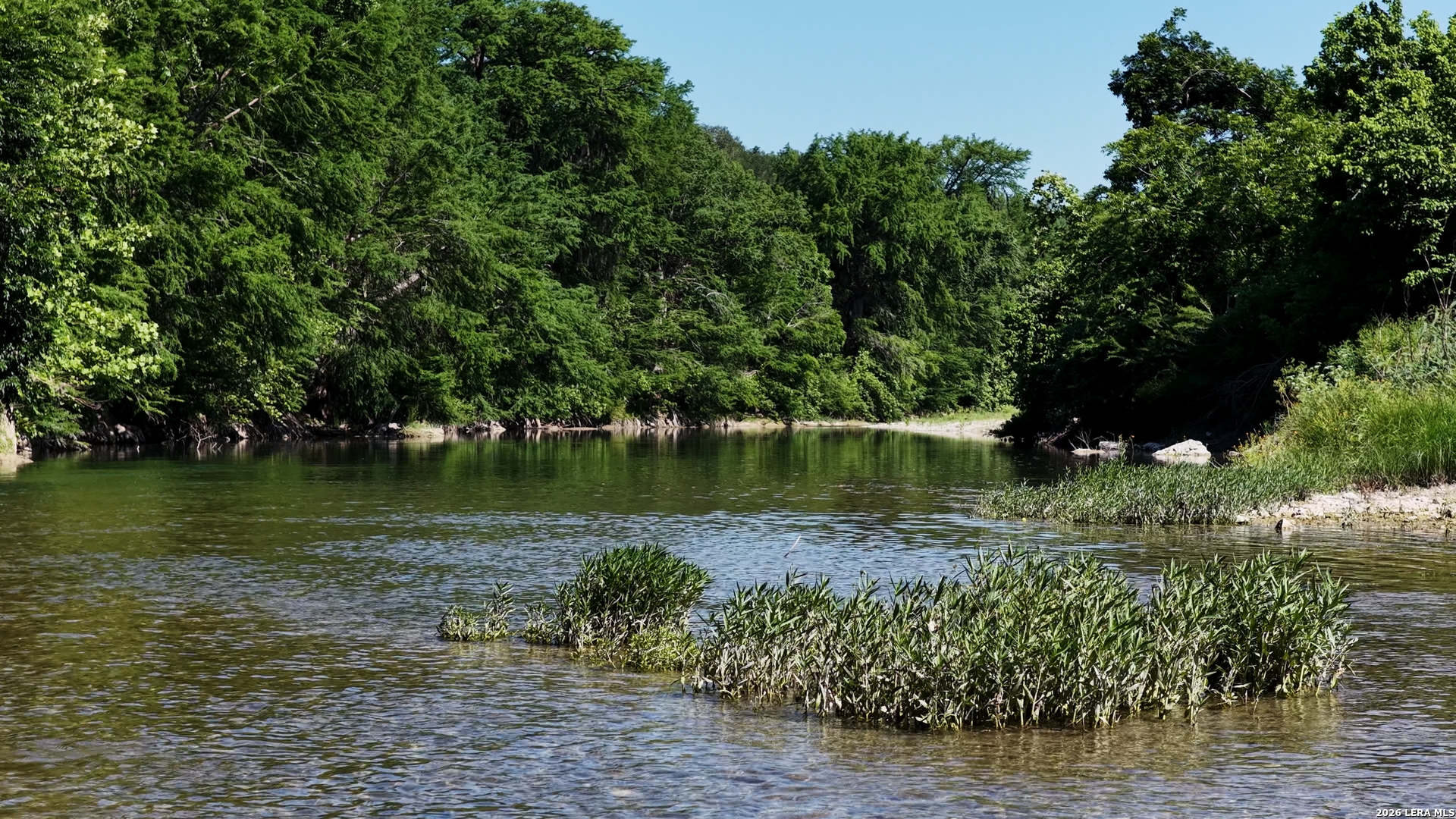 682 Winding River Lane Spring Branch, TX 78070 - Photo 15 of 21 a view of a lake with a outdoor space