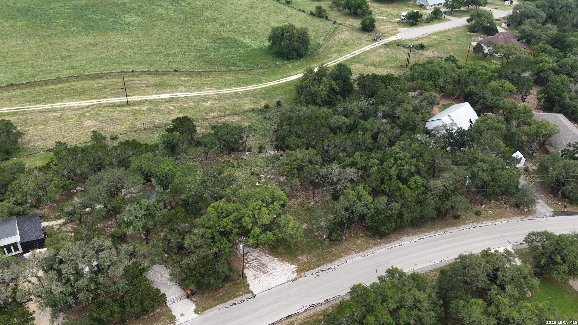 682 Winding River Lane Spring Branch, TX 78070 - Photo 19 of 21 a view of a forest with a street