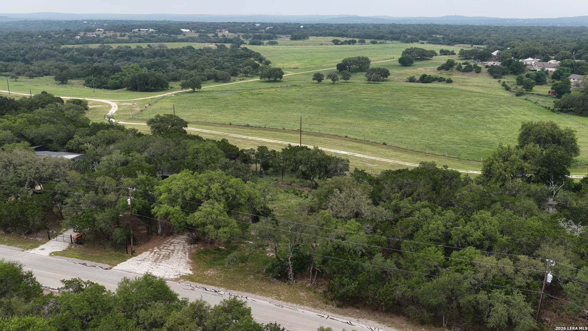 682 Winding River Lane Spring Branch, TX 78070 - Photo 20 of 21 an aerial view of a houses with outdoor space and trees