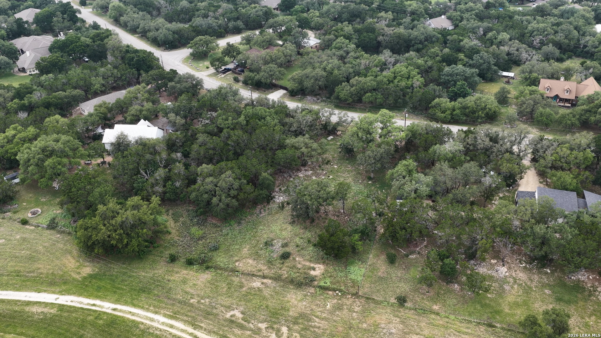 682 Winding River Lane Spring Branch, TX 78070 - Photo 21 of 21 a view of a forest with a house