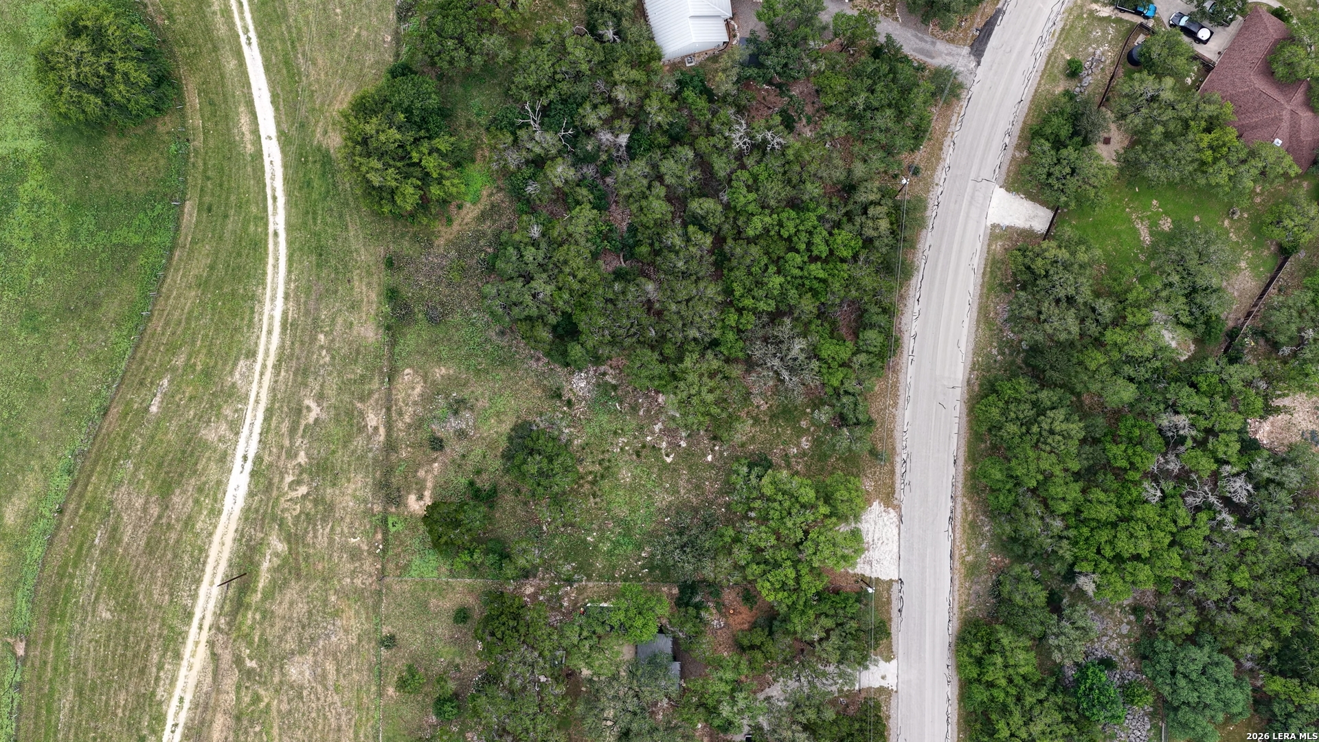 682 Winding River Lane Spring Branch, TX 78070 - Photo 4 of 21 an aerial view of residential house with outdoor space and trees all around