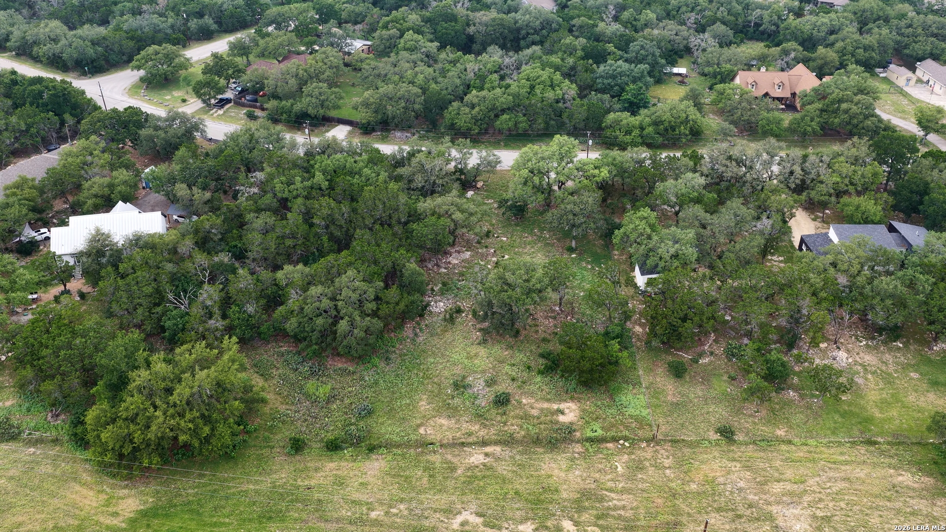 682 Winding River Lane Spring Branch, TX 78070 - Photo 6 of 21 a view of a forest with a houses