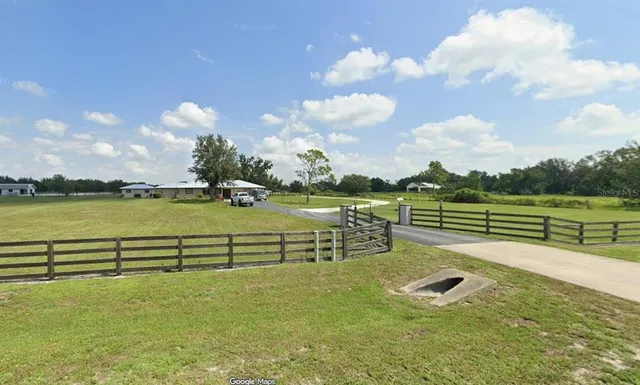 a view of a lake with a big yard