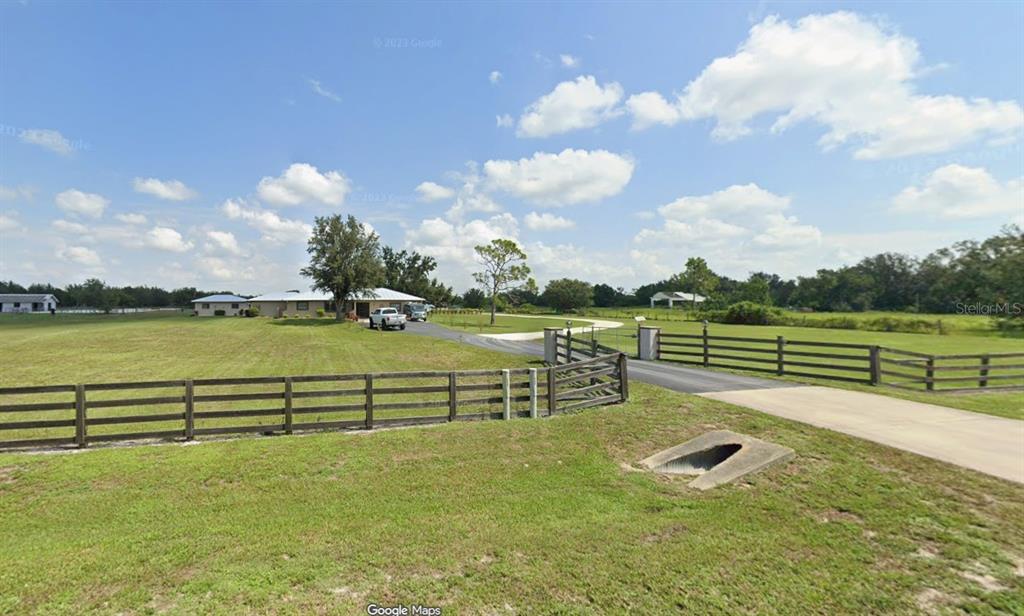 a view of a lake with a big yard