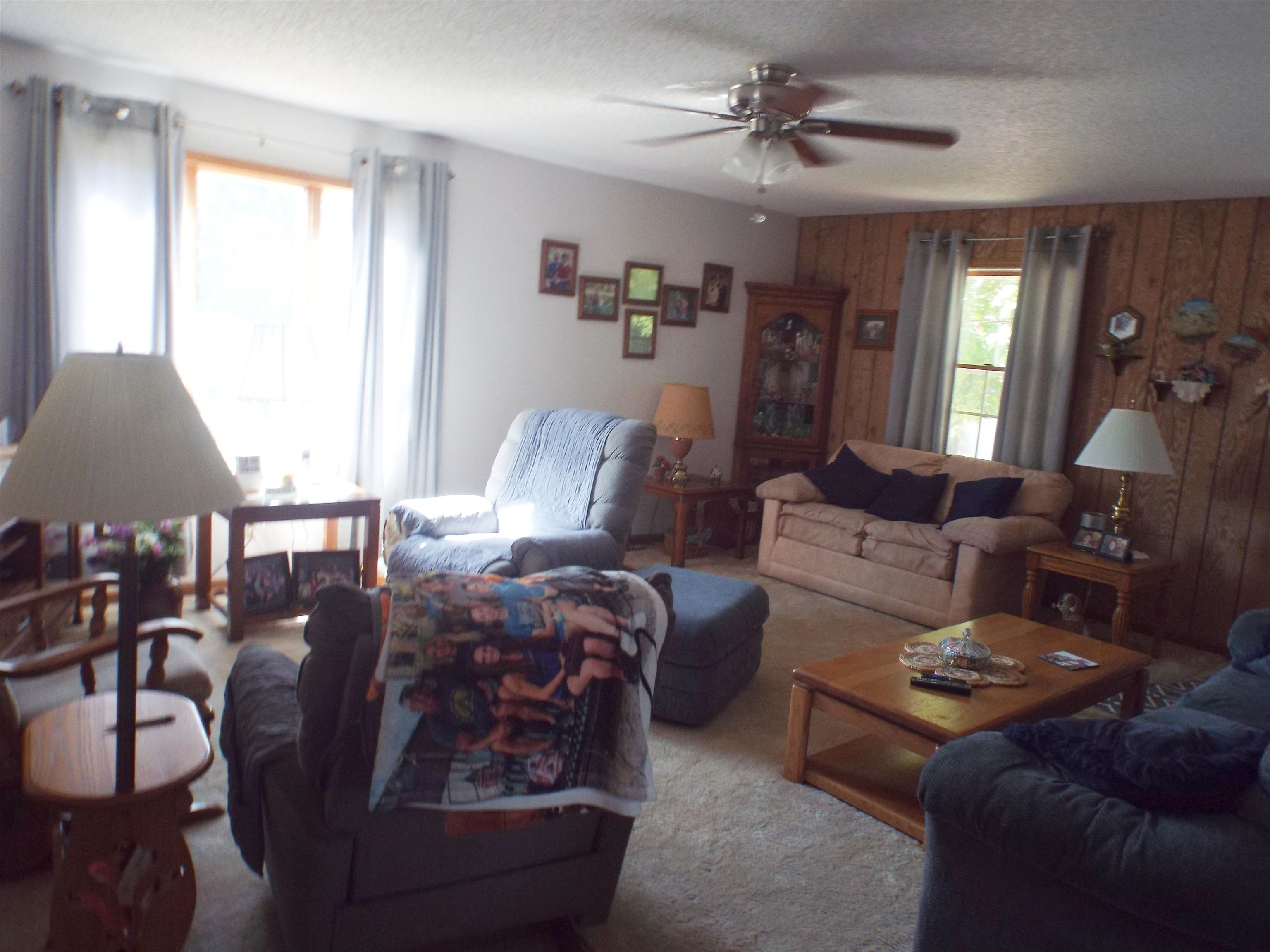 216 South Long Street Warren, IL 61087 - Photo 12 of 19 a living room with furniture and wooden floor