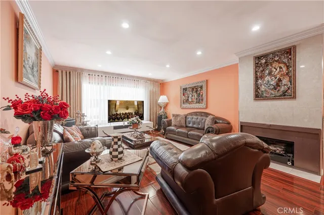 a living room with furniture and flowers