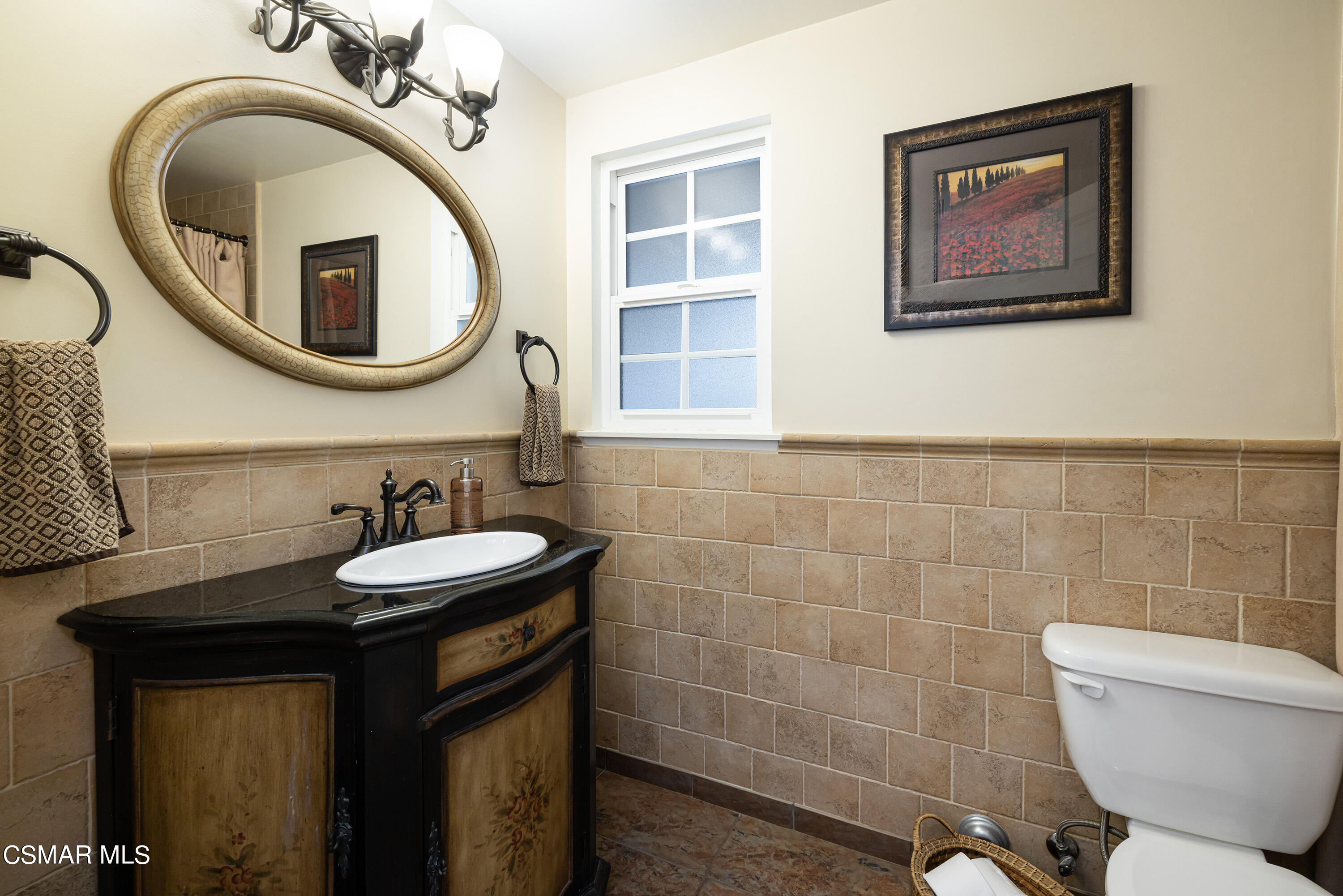 5609 Parkmor Road Calabasas, CA 91302 - Photo 18 of 37 a bathroom with a toilet a sink and mirror