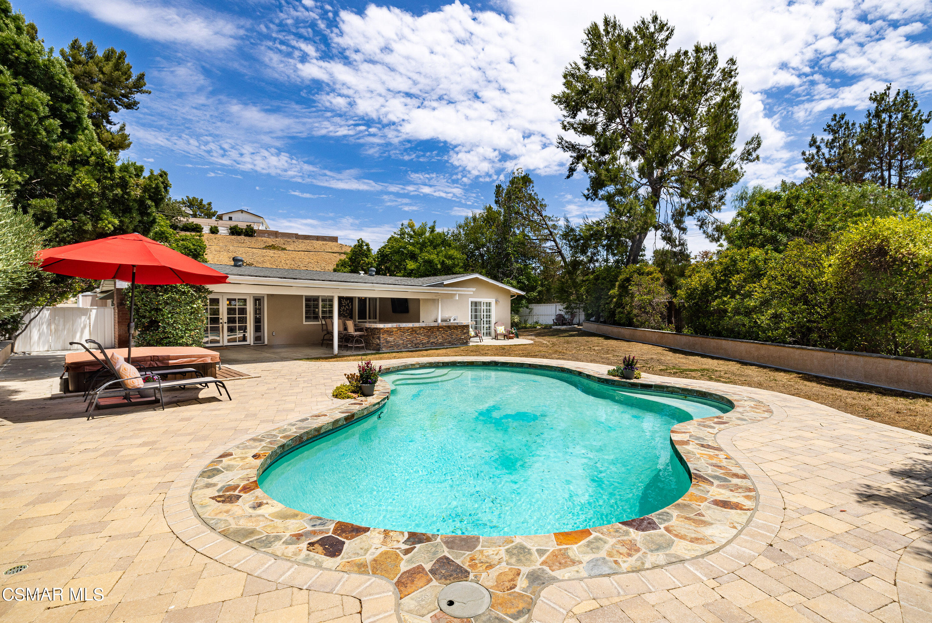 5609 Parkmor Road Calabasas, CA 91302 - Photo 28 of 37 a swimming pool with outdoor seating