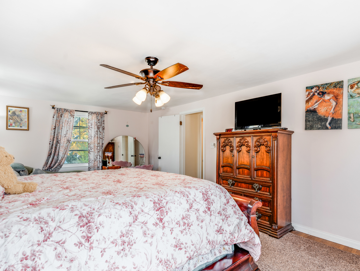 1416 West Acres Road Joliet, IL 60435 - Photo 17 of 30 a bedroom with a bed and a flat screen tv