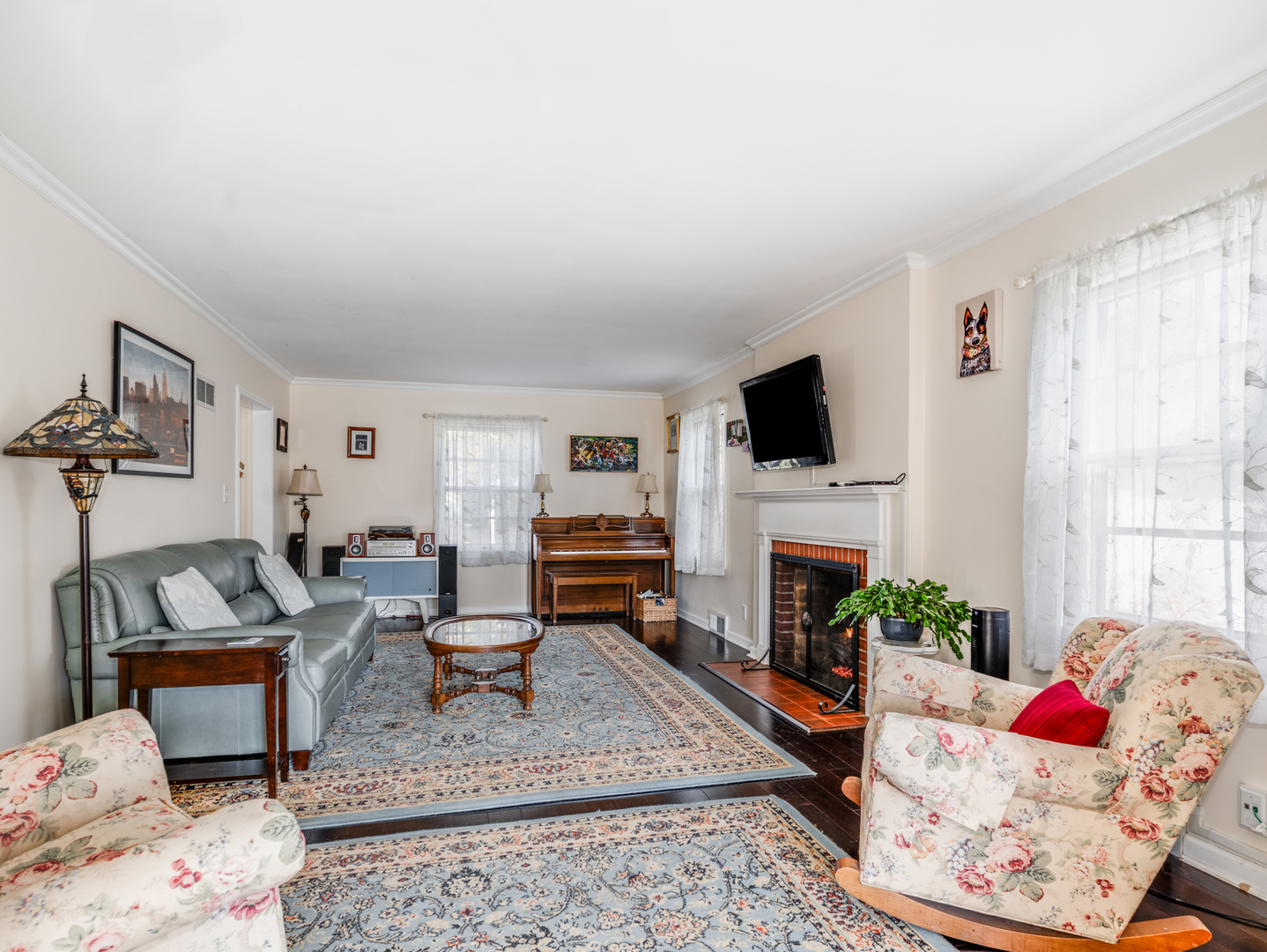 1416 West Acres Road Joliet, IL 60435 - Photo 4 of 30 a living room with furniture and a fireplace