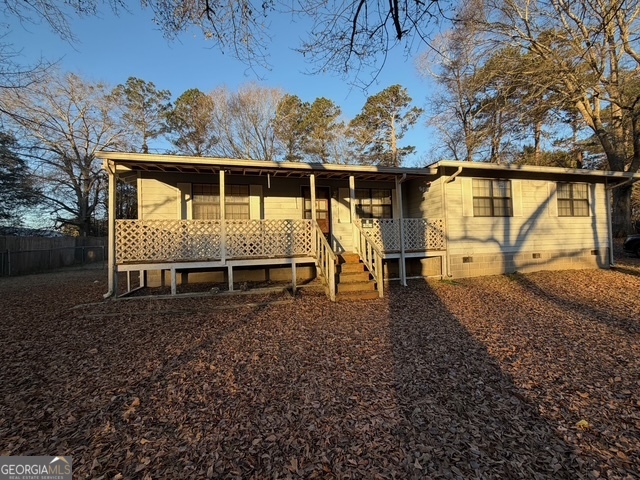 119 Lambert Drive Stockbridge, GA 30281 - Photo 1 of 1 a house with trees in the background