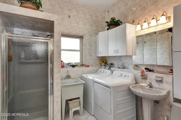 a bathroom with a granite countertop toilet a sink and a mirror