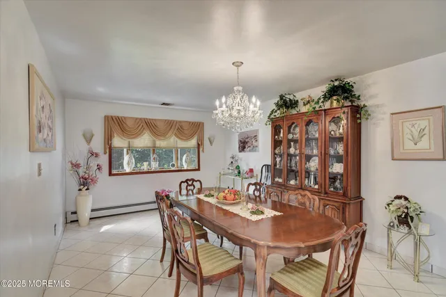 a living room with furniture fireplace and potted plant