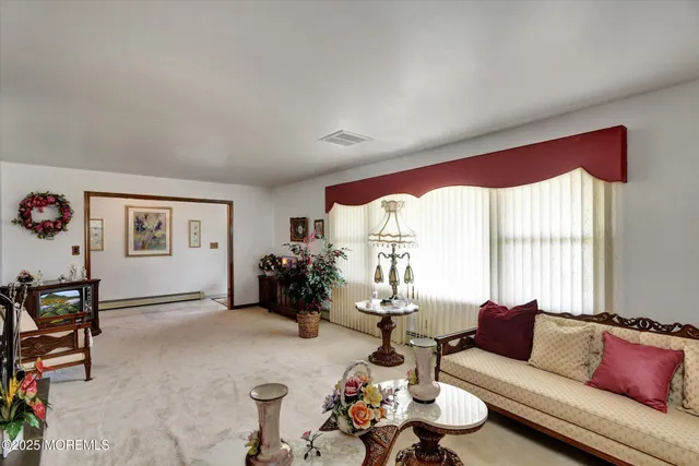 a living room with furniture windows and a fireplace