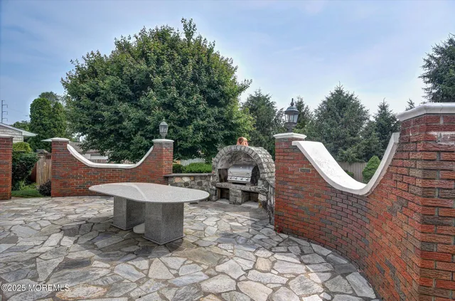 a backyard of a house with table and chairs