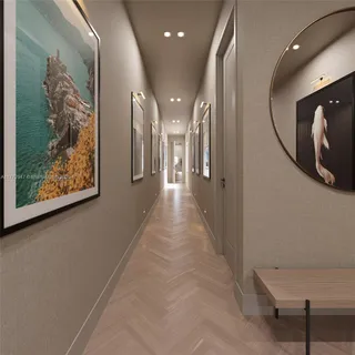 a view of a hallway with paintings on the wall