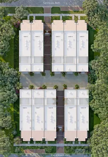 a aerial view of a multi story building with yard and large trees